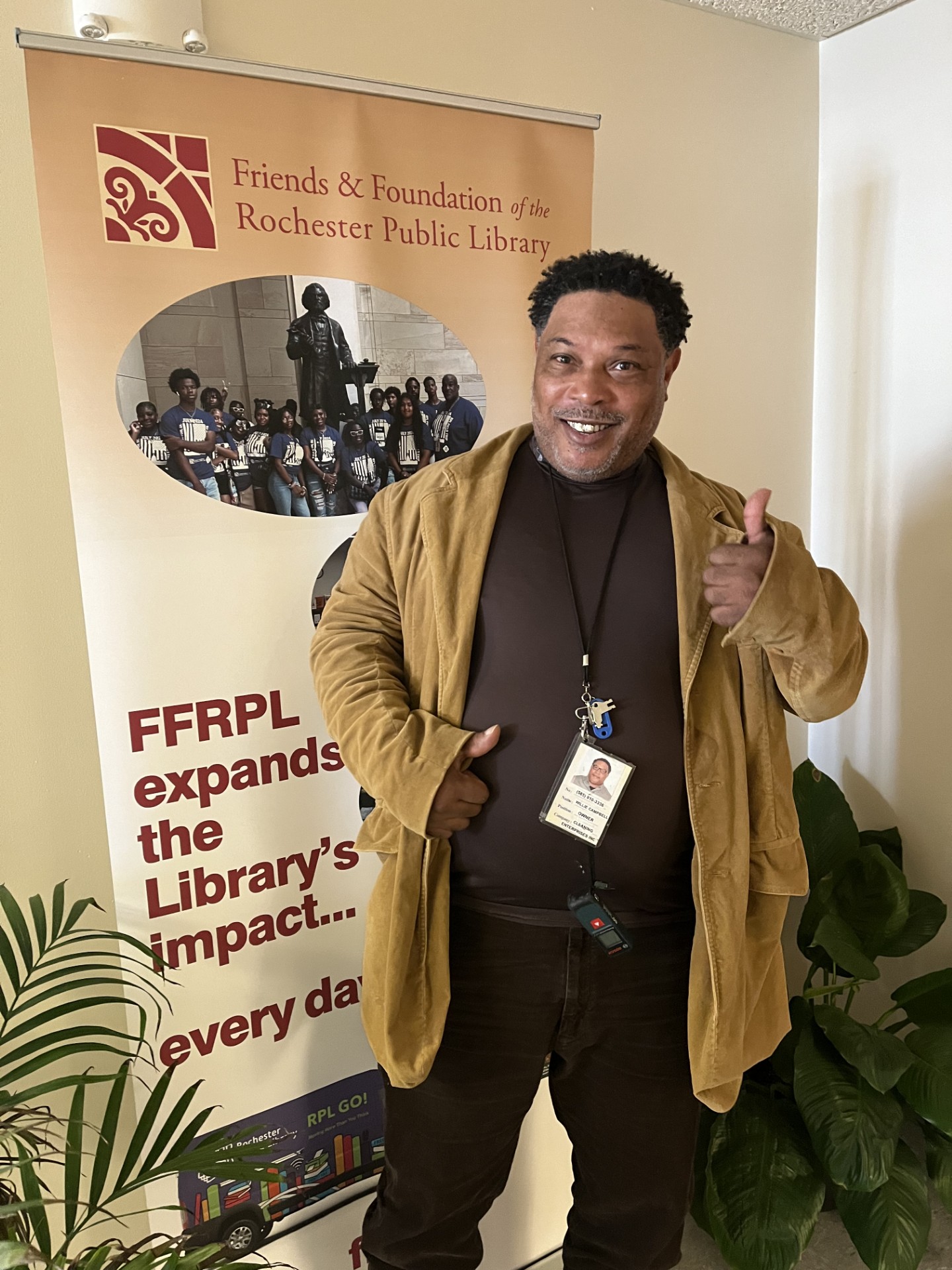 photo of library patron Willie Campbell near FFRPL sign