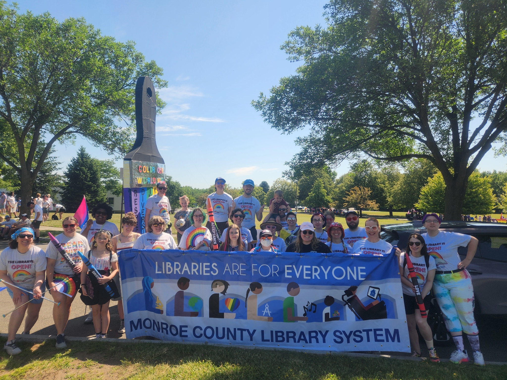 photo at Library staff at Pride Parade with banner "Libraries are for Everyone" 